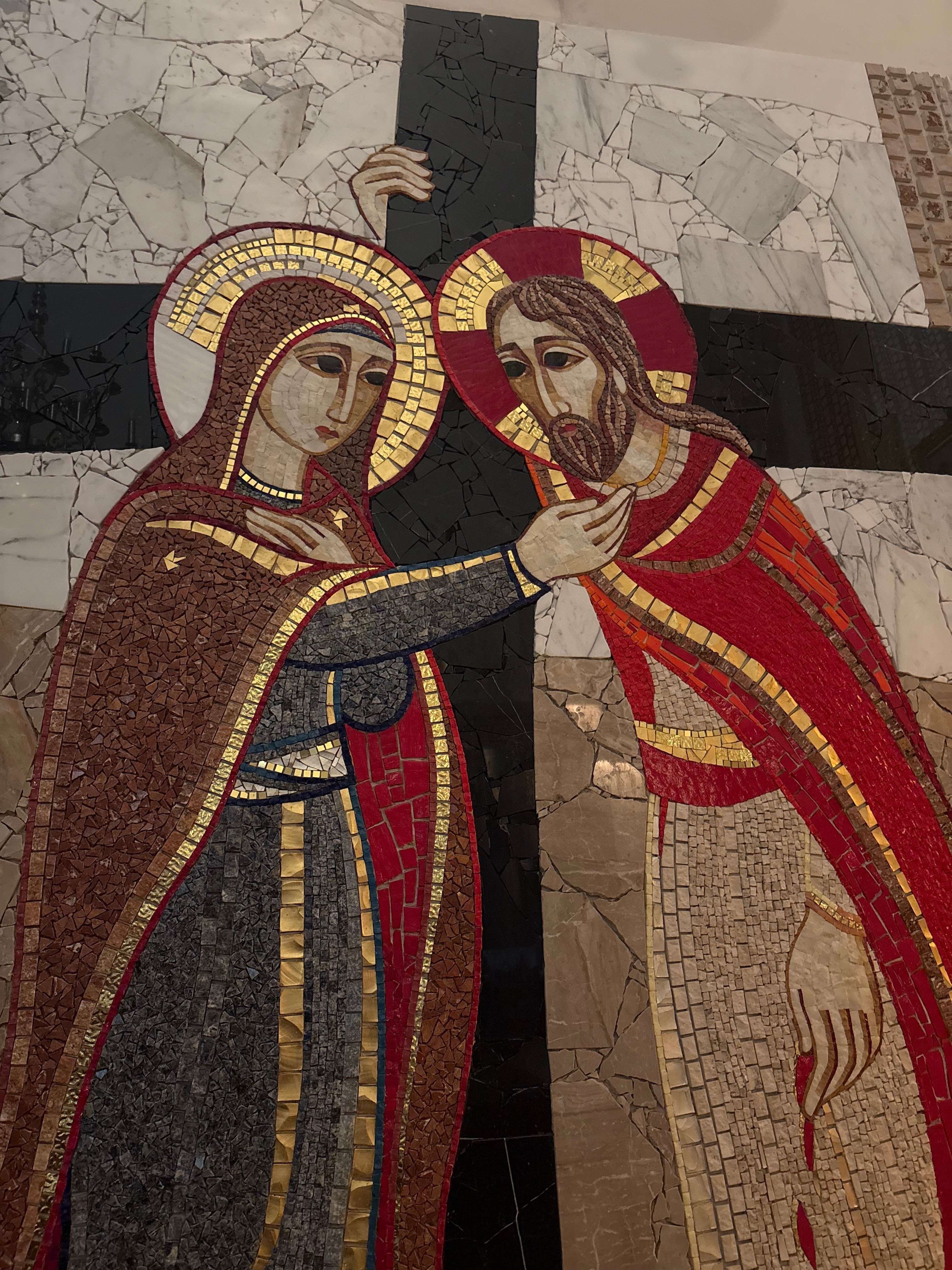A Catholic mosaic of Christ embracing His Bride
