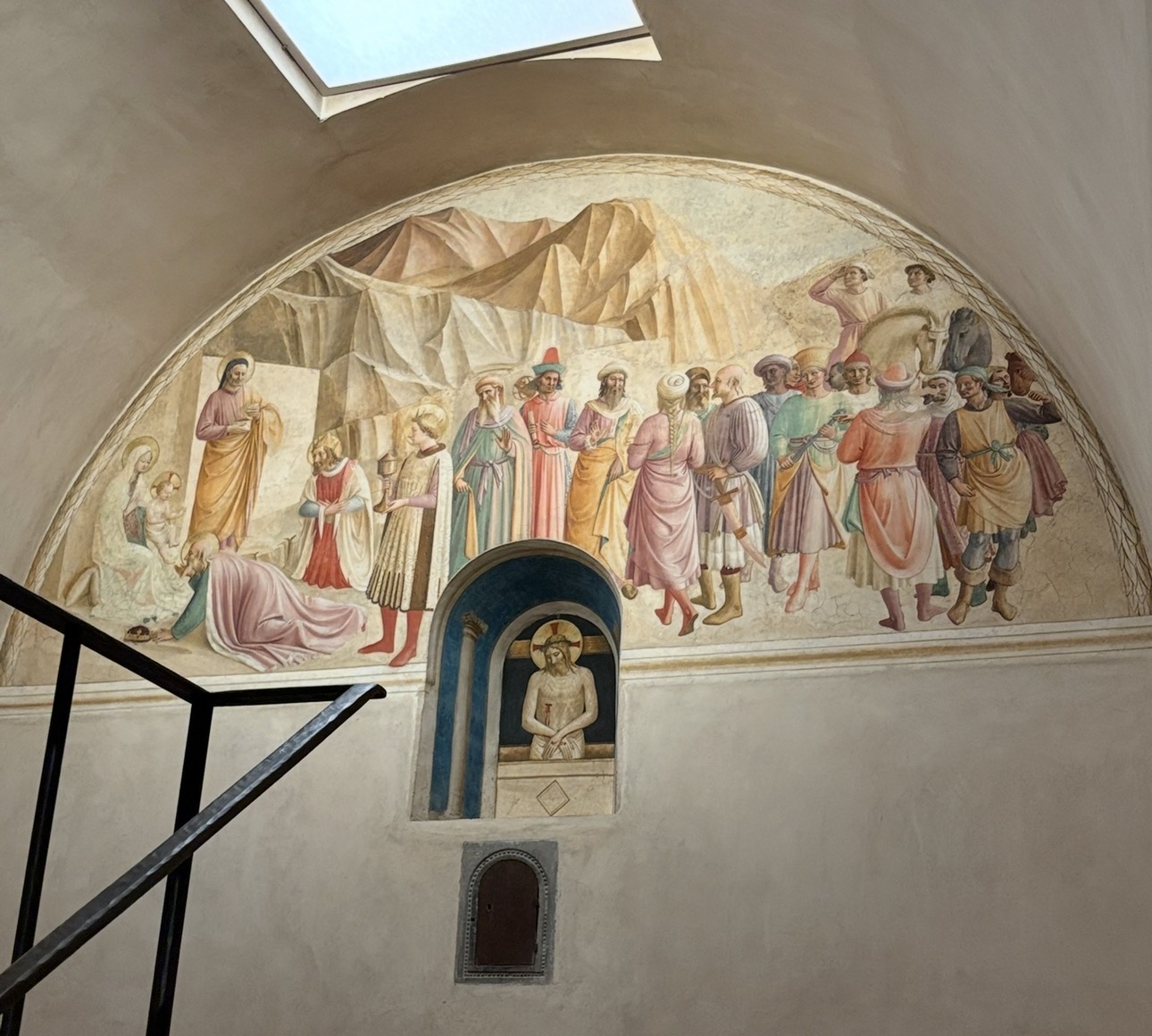 Renaissance fresco of the Adoration of the Magi beneath an arched vault